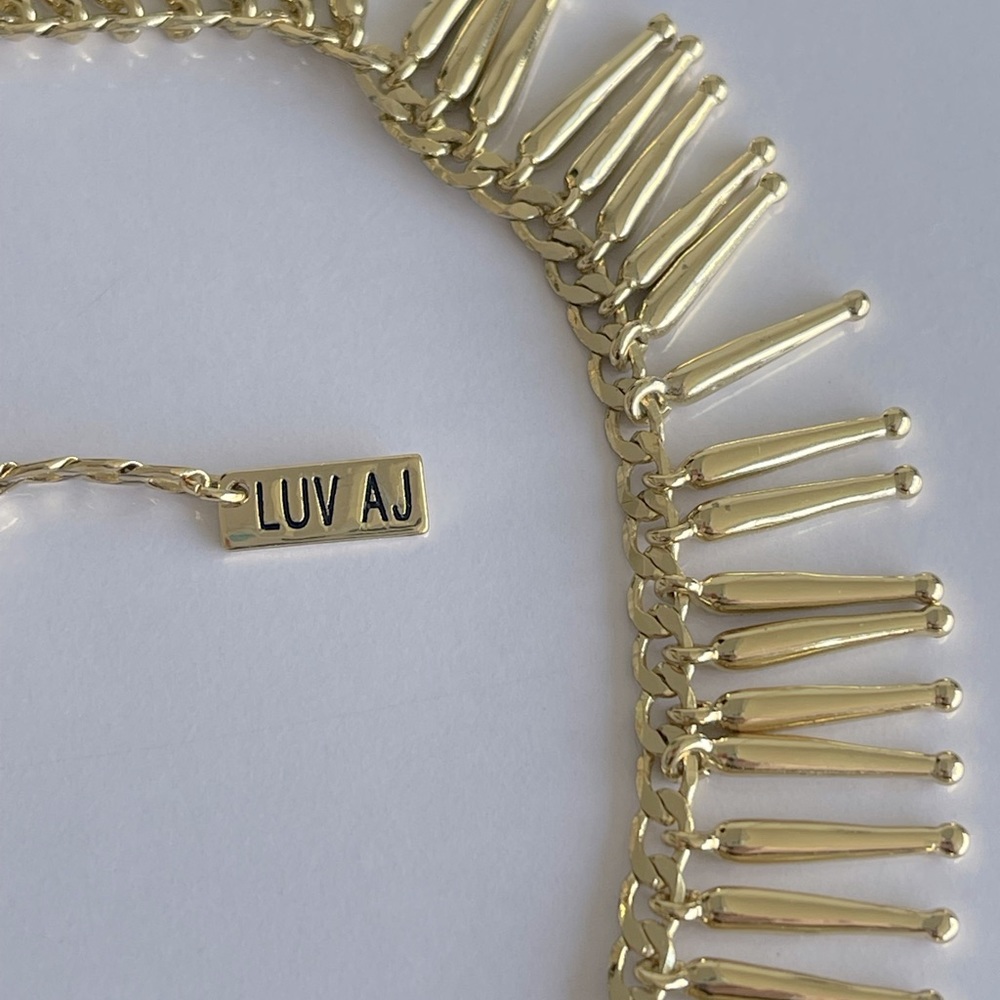 Stunning, sexy & unique gold-plated LUV AJ necklace 💛 From DASH Melrose.